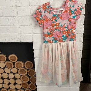 Flora with tule and puff balls in the skirt